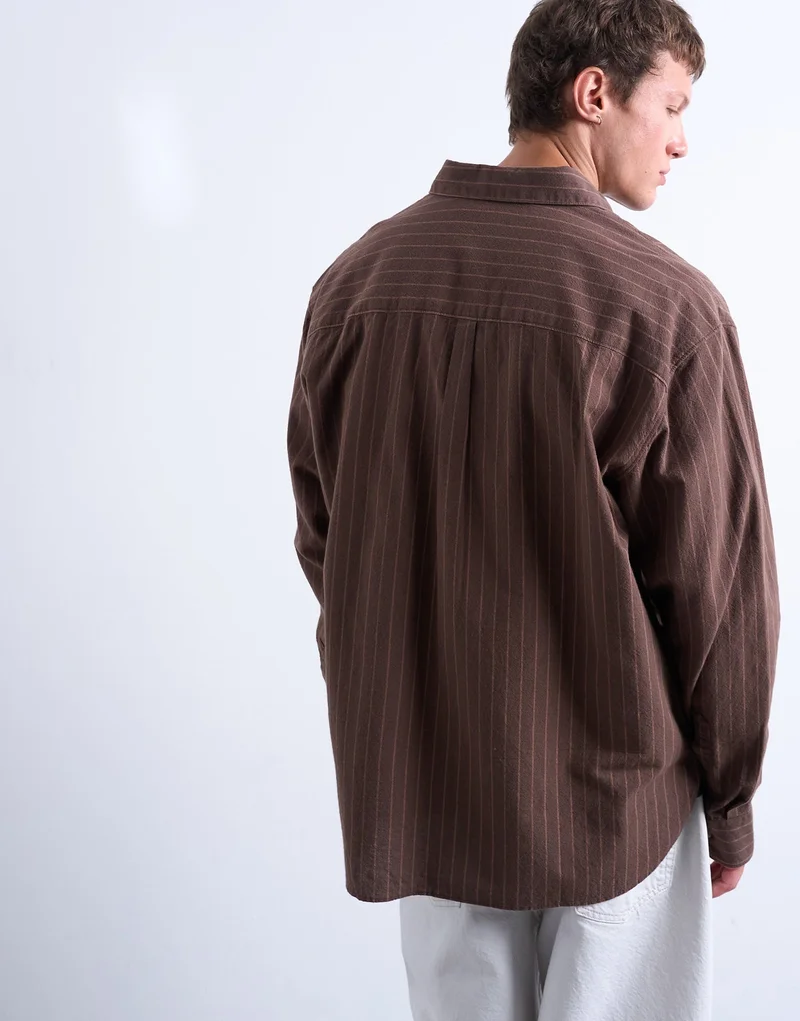 توب مان تيشيرت بأكمام طويلة مخطط مغسول